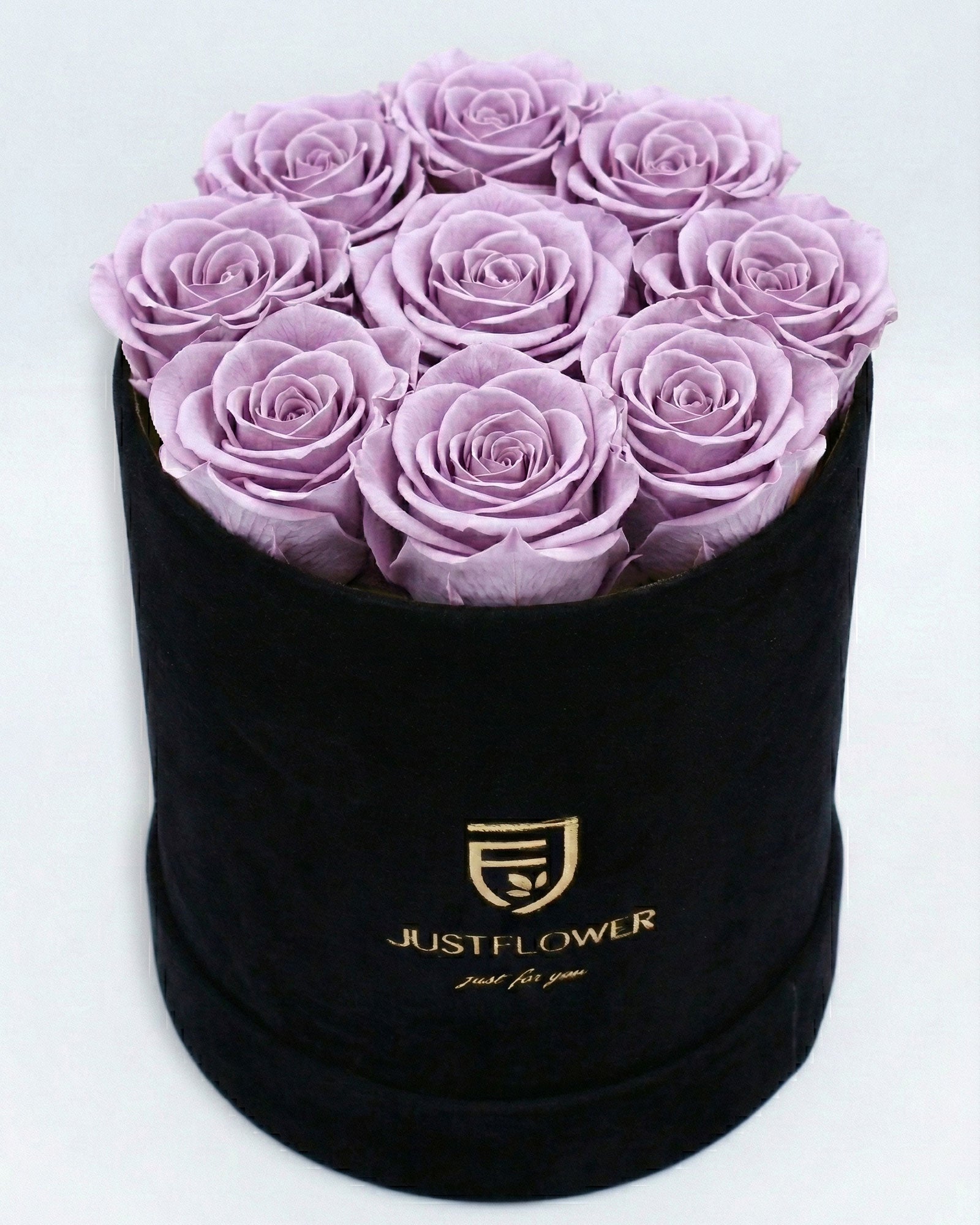 Rosenbox Rund Medium Schwarz Velvet mit lila Infinity Rosen – auffällige und luxuriöse Dekoration