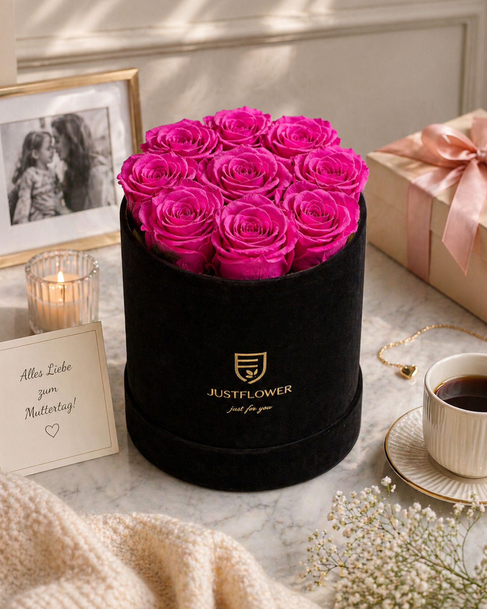 Luxus Rosenbox in Schwarz mit intensiven rosa Rosen – stilvolle Geschenkidee zum Muttertag