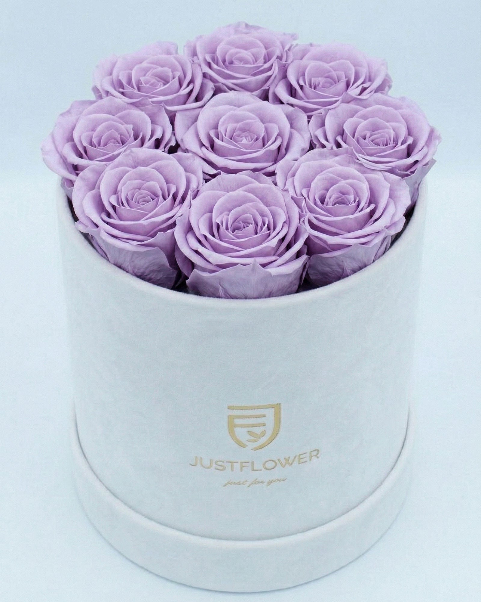 Rosenbox Rund Medium Weiss Velvet mit lila Infinity Rosen – auffällige und elegante Dekoration