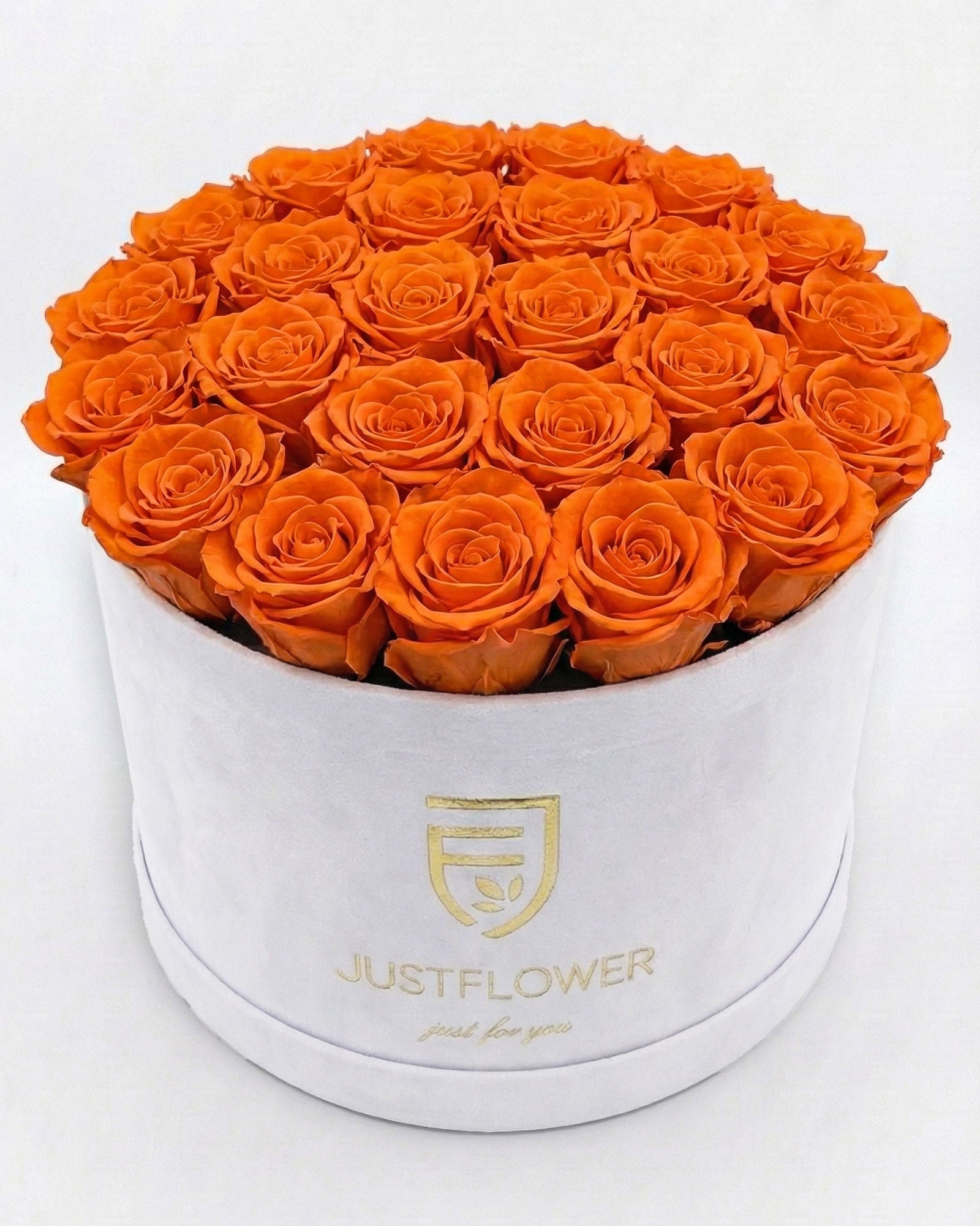 Rosenbox Rund XL in Weiss mit orangefarbenen Infinity Rosen – auffällige Rosenbox modern und dekorativ.