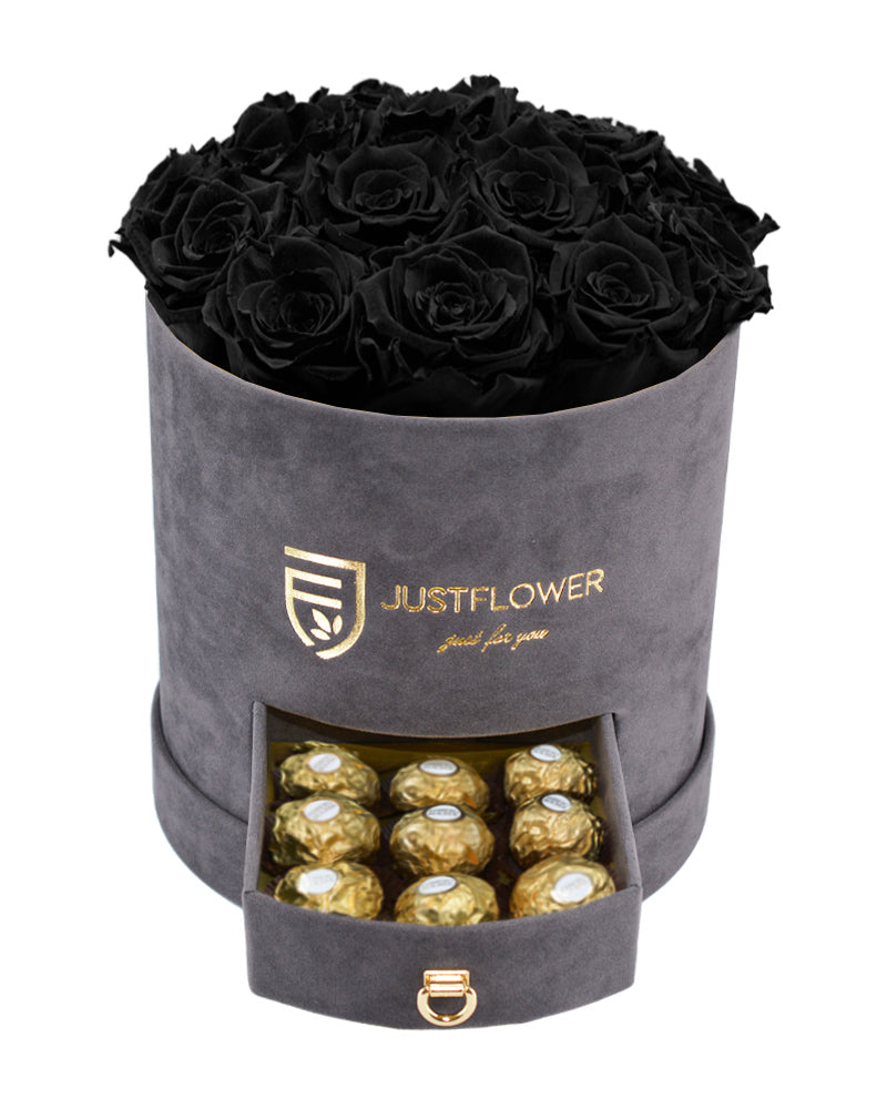 Rosenbox mit schwarzen Infinity Rosen – Graue Rosenbox mit konservierten schwarzen ewigen Rosen und einer Schublade voller Ferrero Rocher. Bestellen Sie diese edle Rosenbox bei JustFlower.ch für ein exklusives Geschenk.