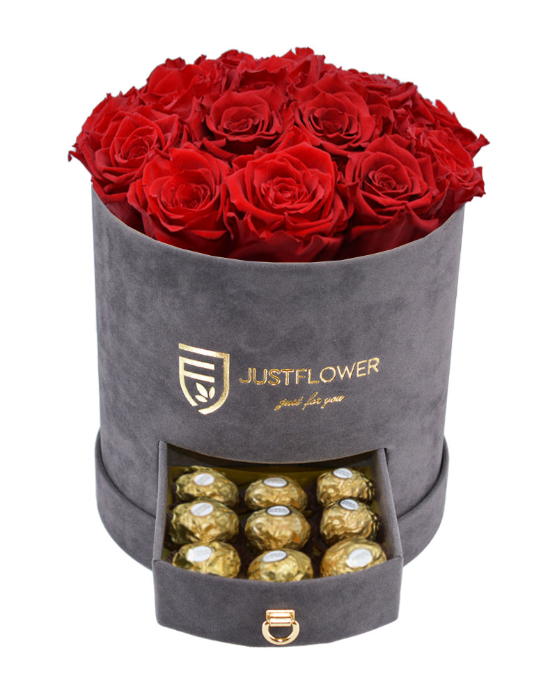 Rosenbox mit roten Infinity Rosen – Graue Rosenbox mit konservierten roten Rosen und einer Schublade voller Ferrero Rocher. Bestellen Sie diese edle Rosenbox bei JustFlower.ch als exklusives Geschenk.