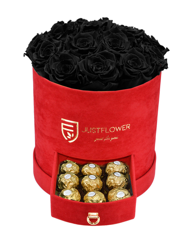 Rosenbox mit Schwarzen Infinity Rosen – Rote Rosenbox mit konservierten schwarzen Rosen und einer Schublade voller Goldschokolade. Bestellen Sie diese luxuriöse Rosenbox bei JustFlower.ch für das ideale Geschenk.