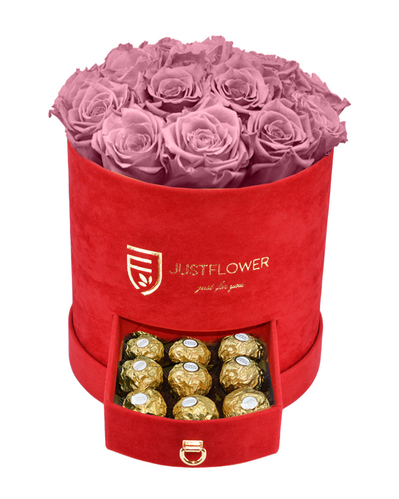 Rosenbox mit Vintage Pinken Infinity Rosen – Rote Rosenbox mit konservierten vintage rosa Rosen und einer Schublade voller Goldschokolade. Bestellen Sie diese luxuriöse Rosenbox bei JustFlower.ch für das perfekte Geschenk.