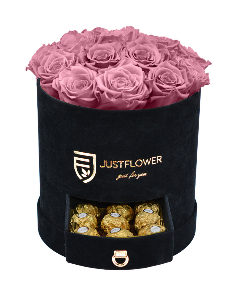 Rosenbox mit Vintage-Pink Infinity Rosen – Schwarze Rosenbox mit konservierten Vintage-Pink Rosen und einer Schublade voller Goldschokolade. Bestellen Sie diese exklusive Rosenbox bei JustFlower.ch und verschenken Sie Luxus.